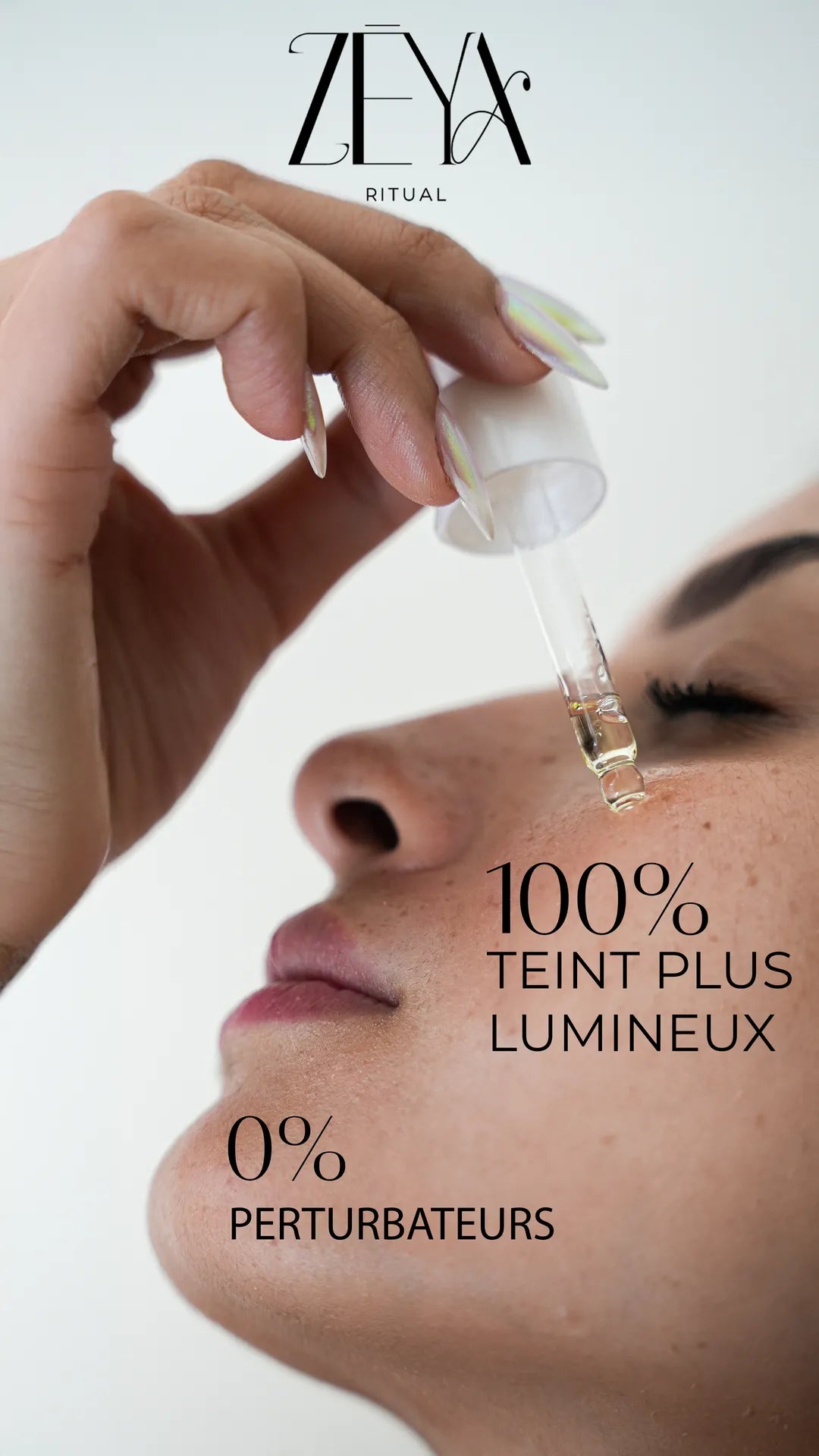 Woman applying rose face oil serum with dropper for luminous skin, hydration, glow and clean non-toxic skincare benefits.